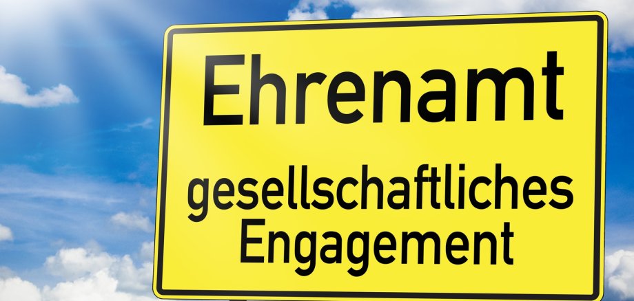 Gelbes Schild: Ehrenamt gesellschaftliches Engagement