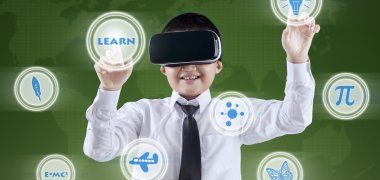 Boy uses VR headset and futuristic screen Boy uses VR headset and futuristic screen