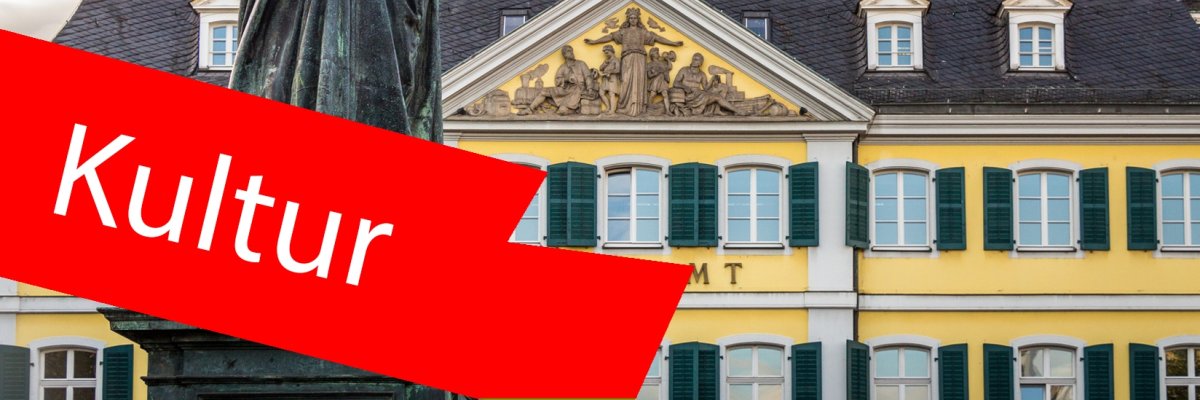 Beethoven-Statur in Bonn. Im Vordergrund ein roter Balken mit der Aufschrift "Kultur". Beethoven-Statur in Bonn. Im Vordergrund ein roter Balken mit der Aufschrift "Kultur".